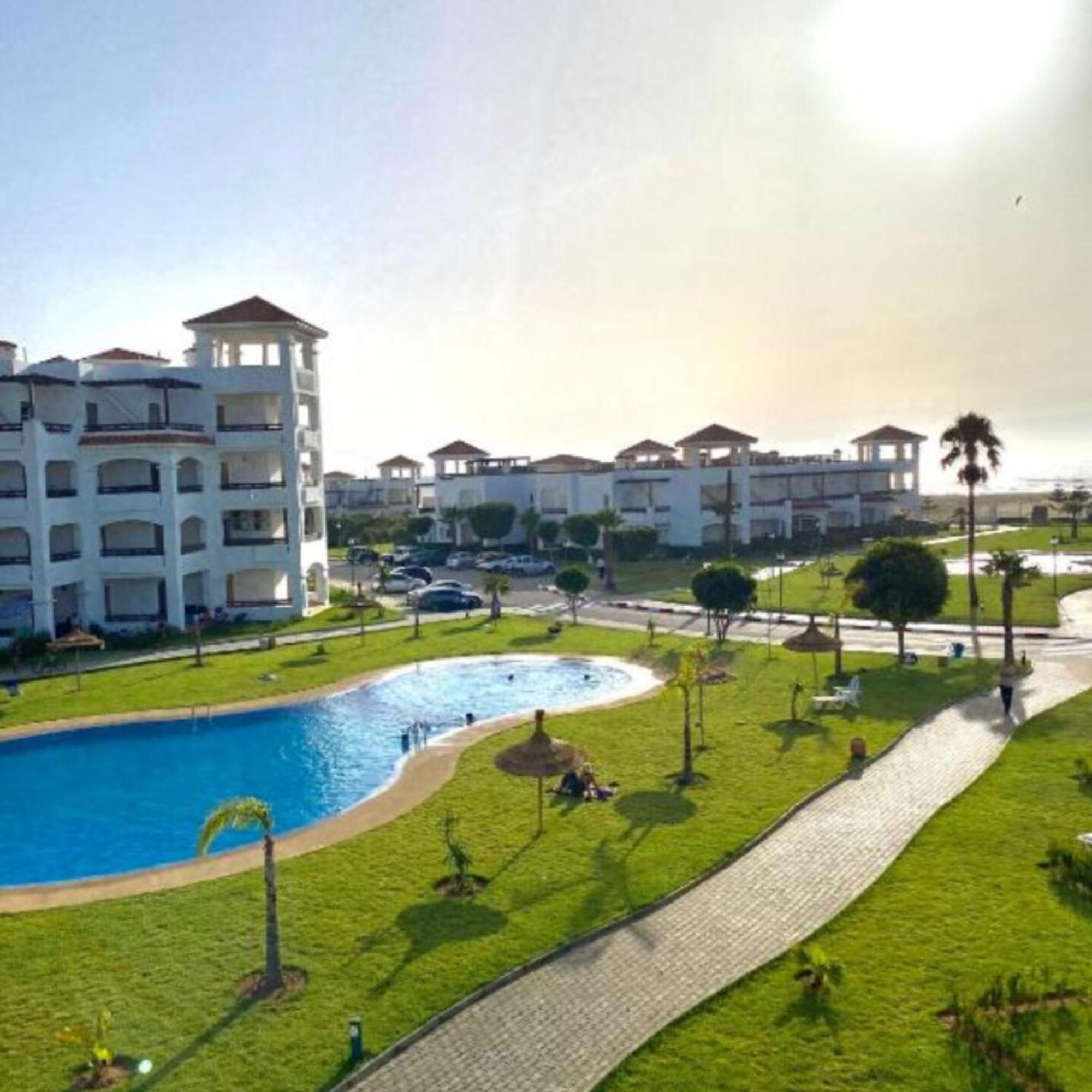 Seaside Poolside Apartment Асила Екстериор снимка